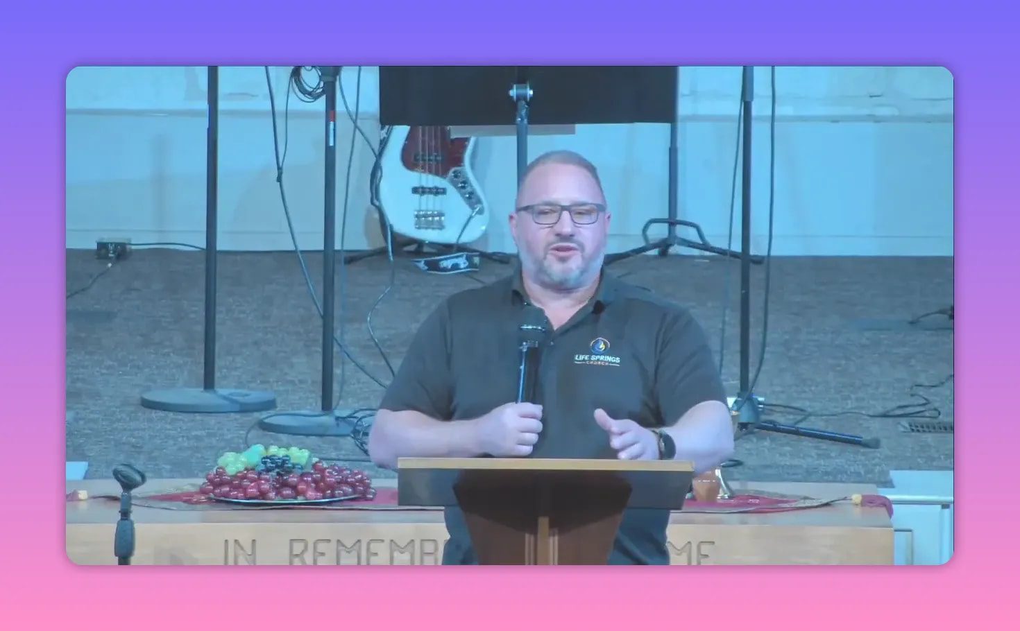 Church speaker addressing the congregation while discussing God’s deliverance