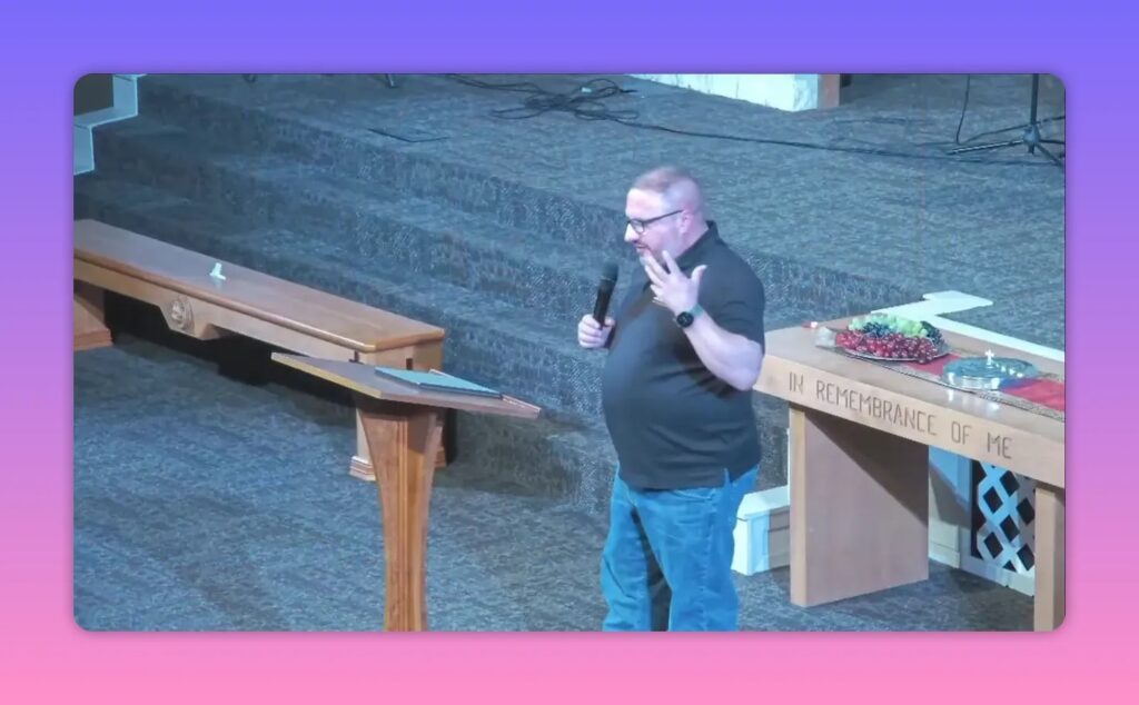 Pastor preaching near a church pulpit with stained glass backdrop