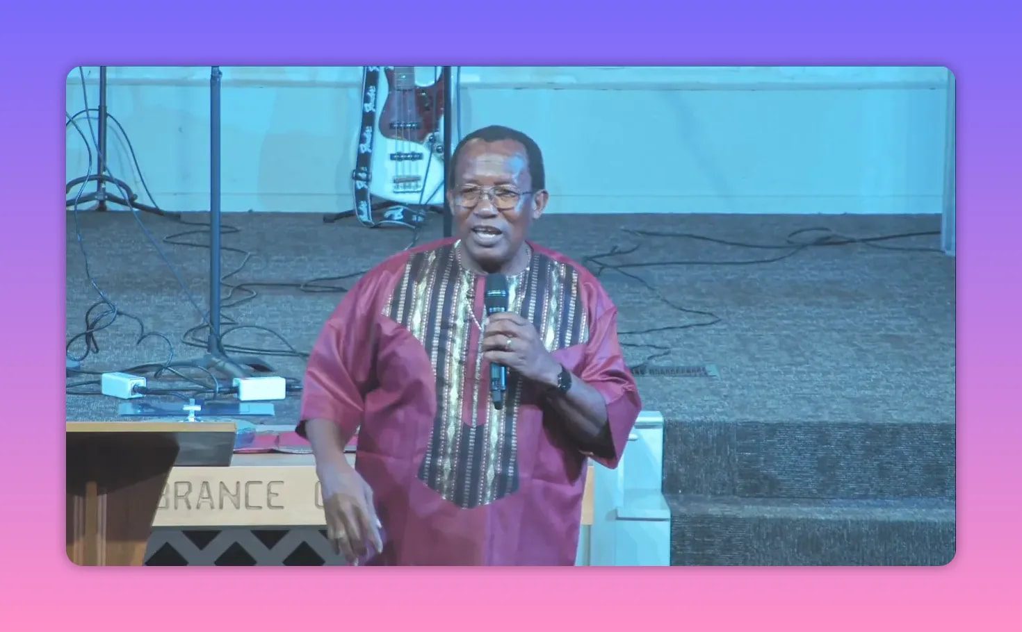 Pastor speaking into a microphone while teaching that freedom begins with a decision to refuse old limits