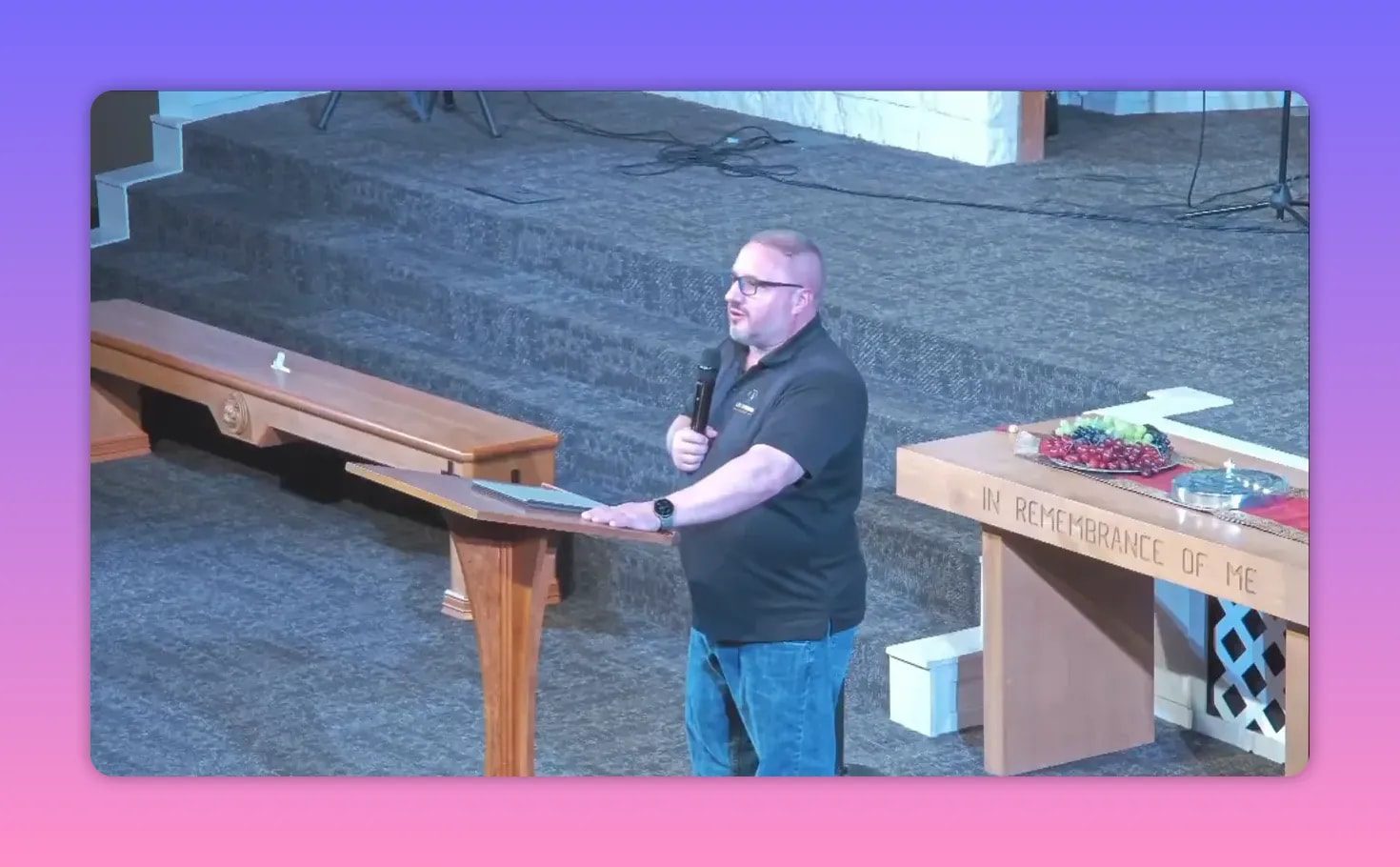 Speaker delivering sermon from church pulpit with microphone